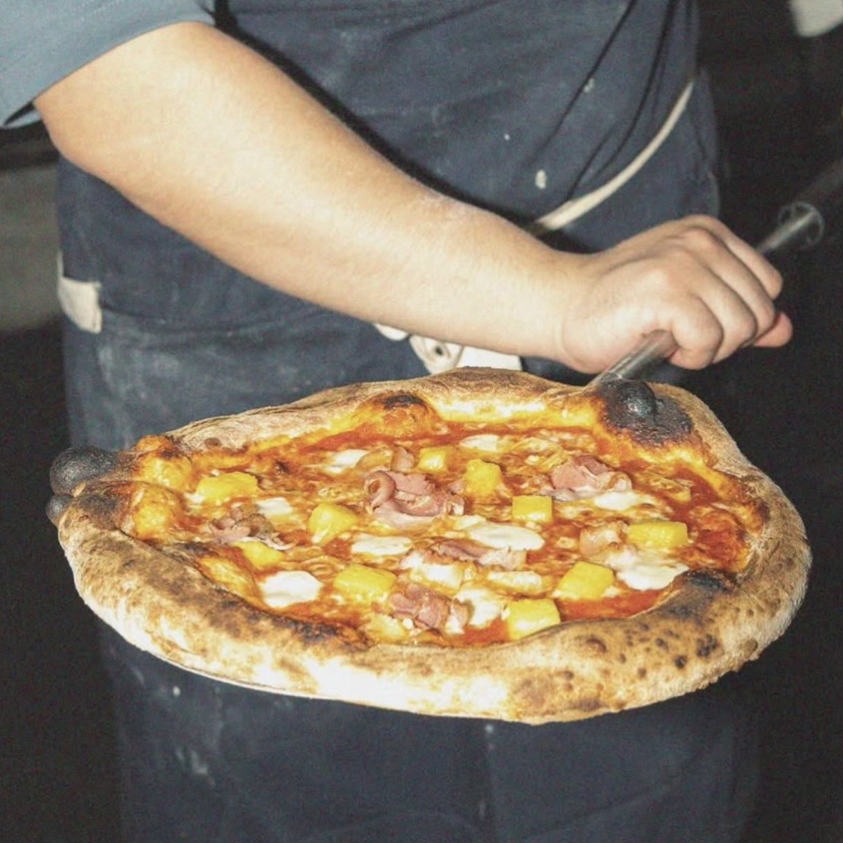 Pineapple pie with pancetta, pickled jalapeño, mozzarella and aged gouda at Burnt Mouth Pizza Orlando